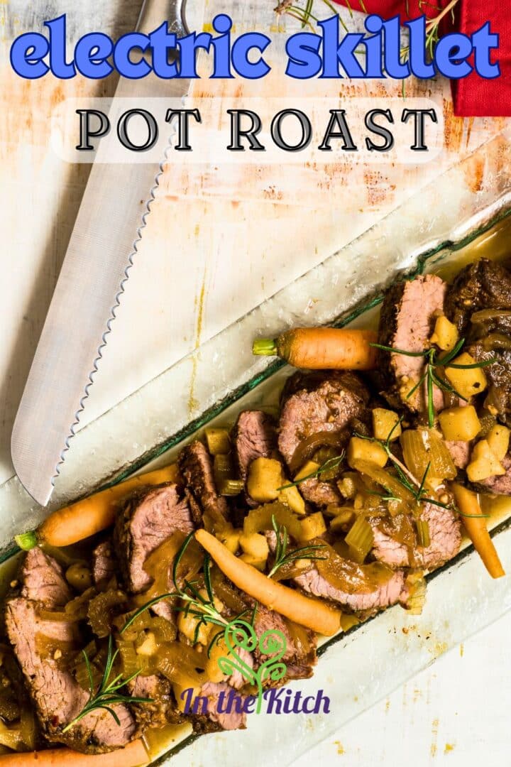 Pot roast with vegetables on serving tray and text overlay that says 'electric skillet pot roast'.