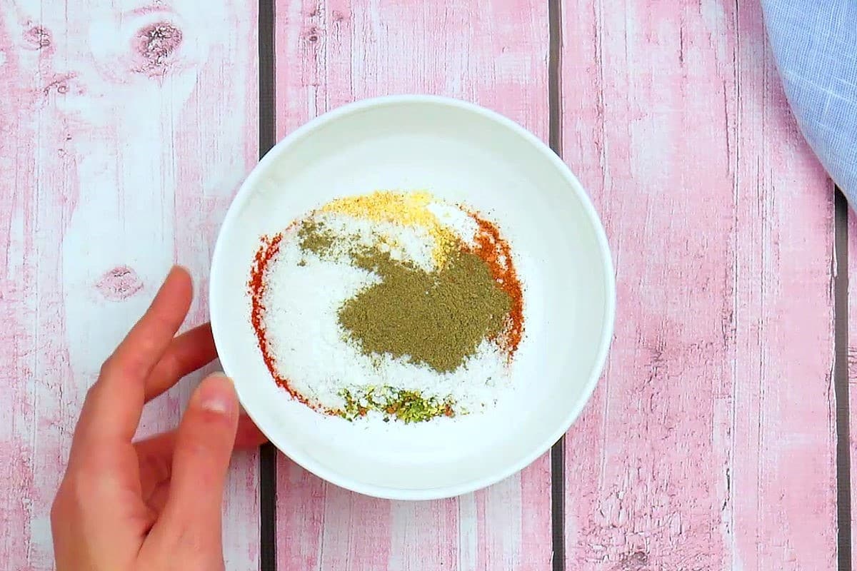 Spices combine in a bowl.