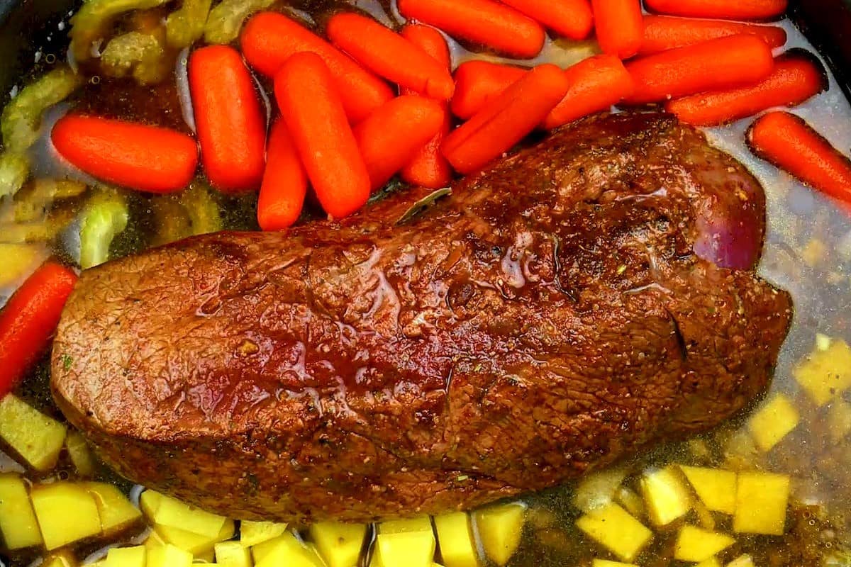 Pot roast and vegetables cooked in electric skillet.