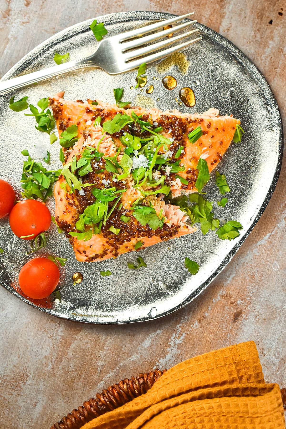 Electric skillet salmon with honey mustard glaze and parsley on plate.