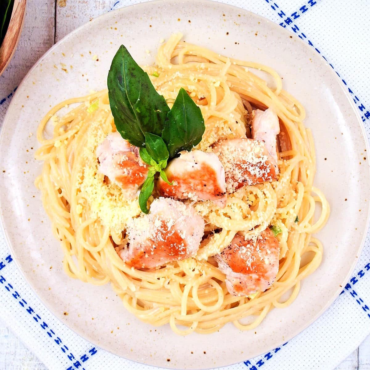 Electric skillet spaghetti alfredo on plate.