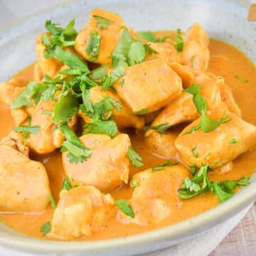 Butter chicken in a bowl.