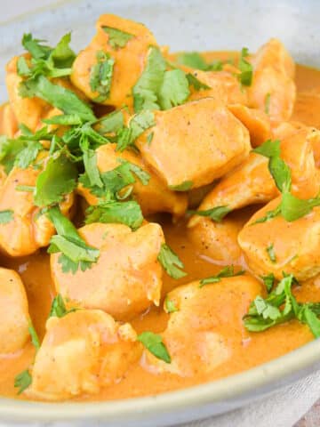 Butter chicken in a bowl.