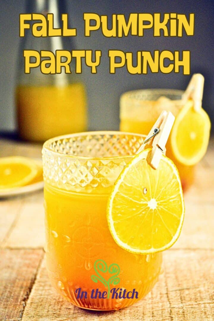 Pumpkin punch in a glass with text overlay that says 'fall pumpkin party punch'.