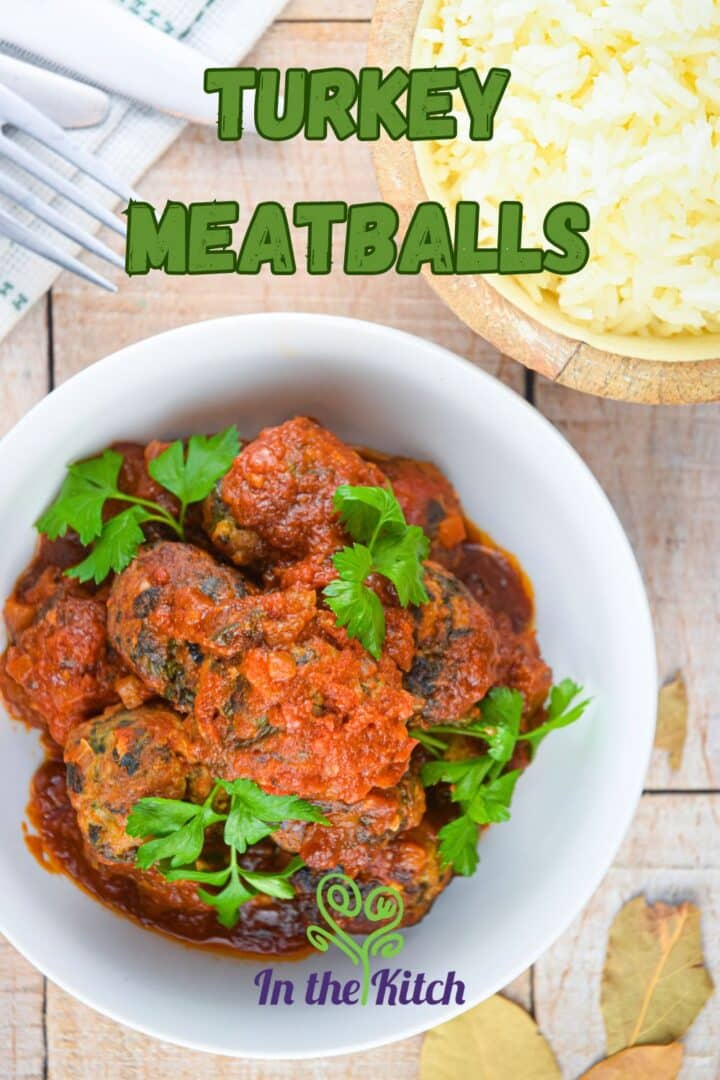 Turkey meatballs in tomato sauce in bowl with text overlay that says 'turkey meatballs'.