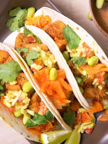 Kimchi cod tacos in serving dish.