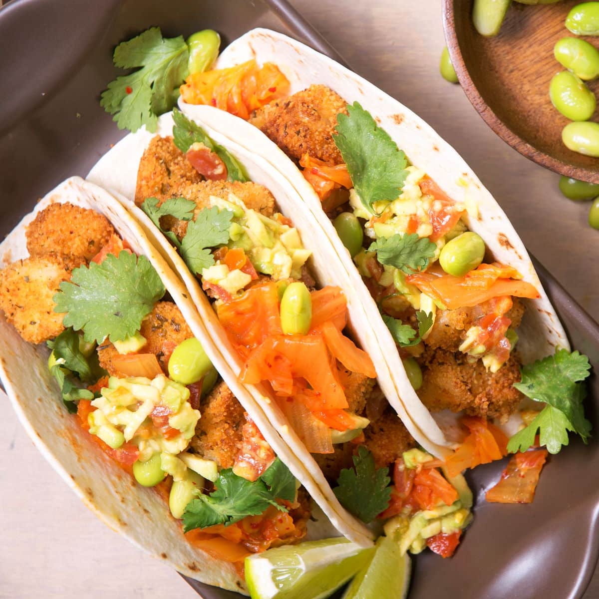 Kimchi cod tacos in serving dish.