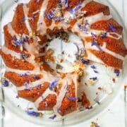 Grapefruit cake with dried edible flowers and icing drizzle.