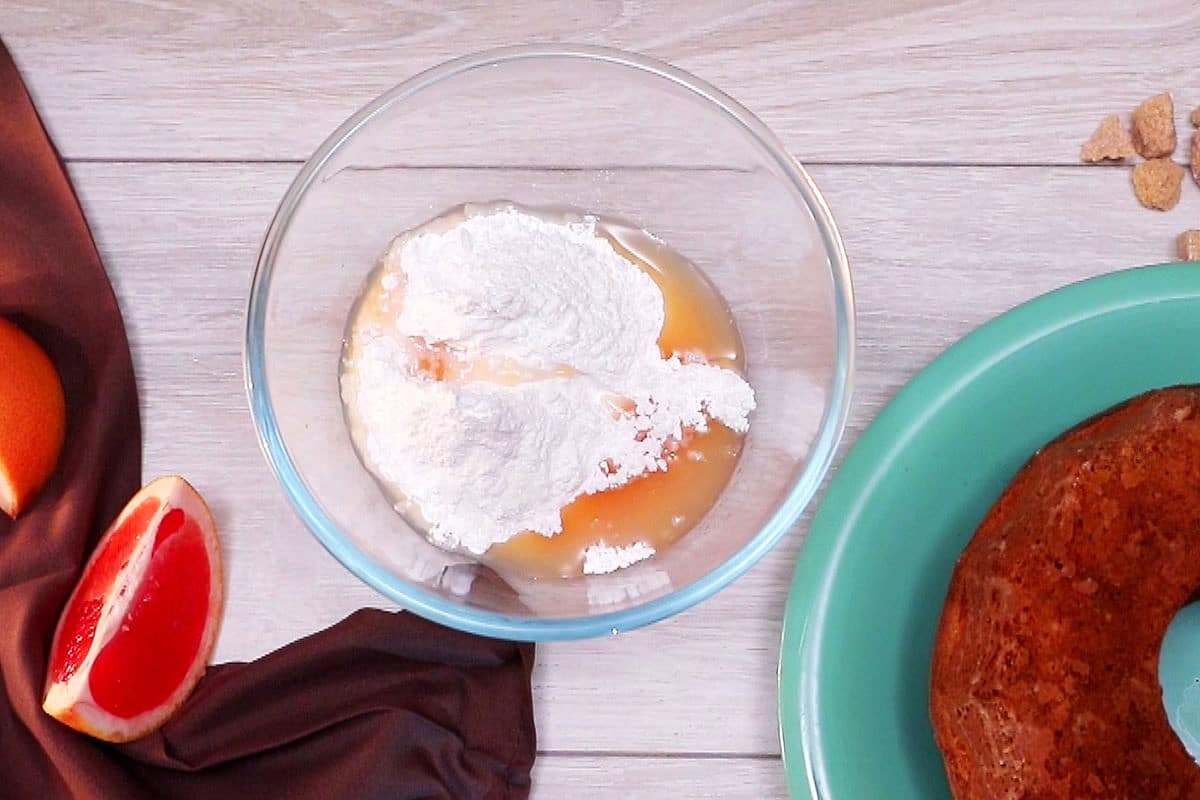Grapefruit juice and icing sugar in bowl.