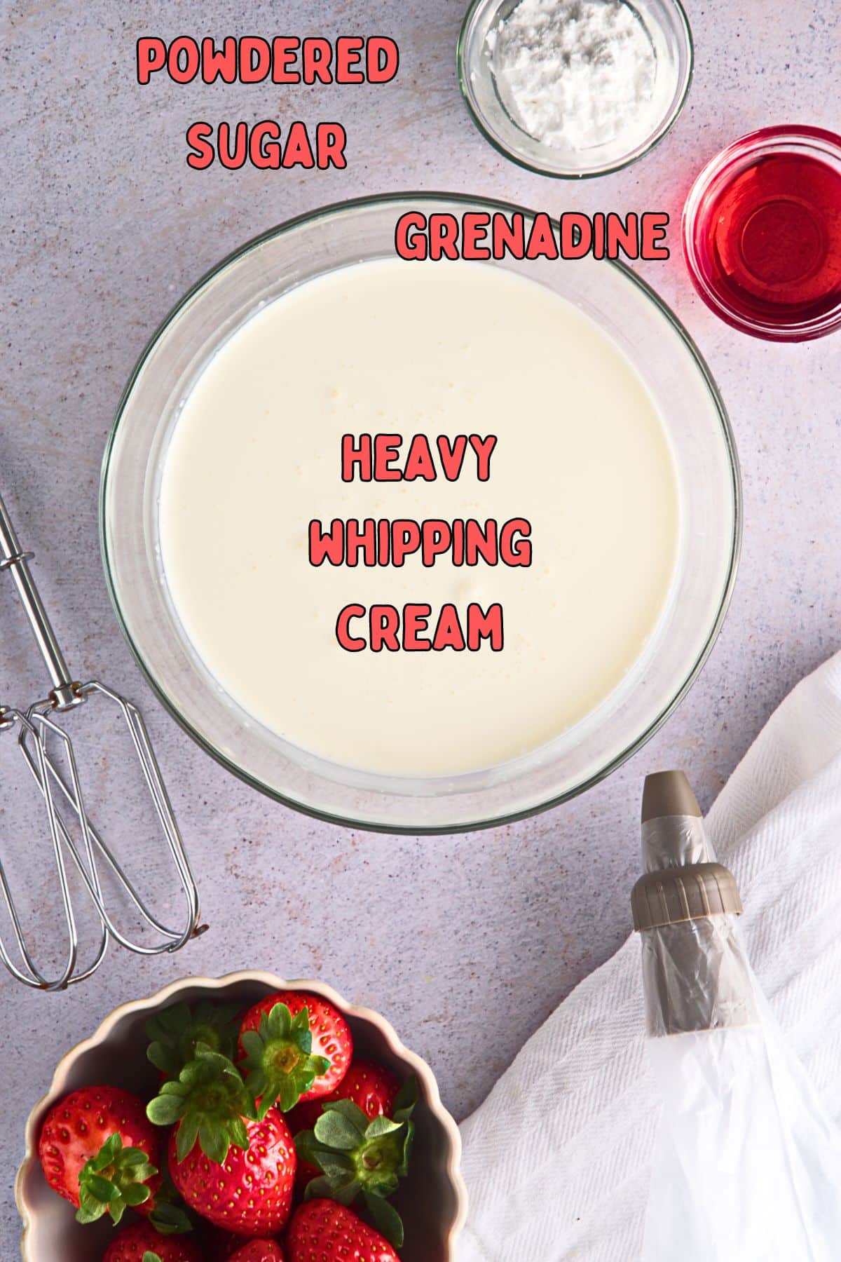 Grenadine whipped cream ingredients prepped and labeled on grey background.