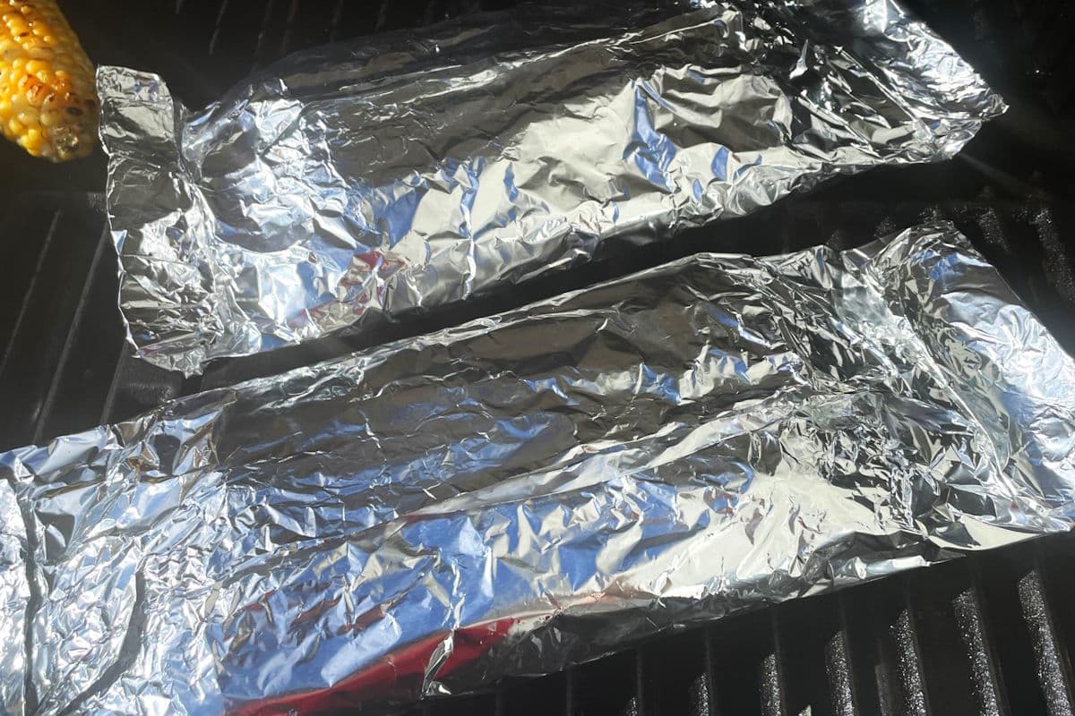 Asparagus foil packets on the outdoor grill.