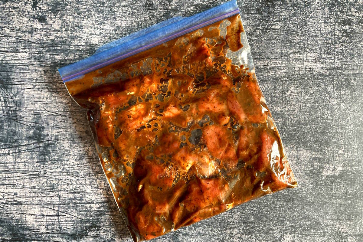 Pork tenderloin cubes in zip-top bag with jerk marinade.
