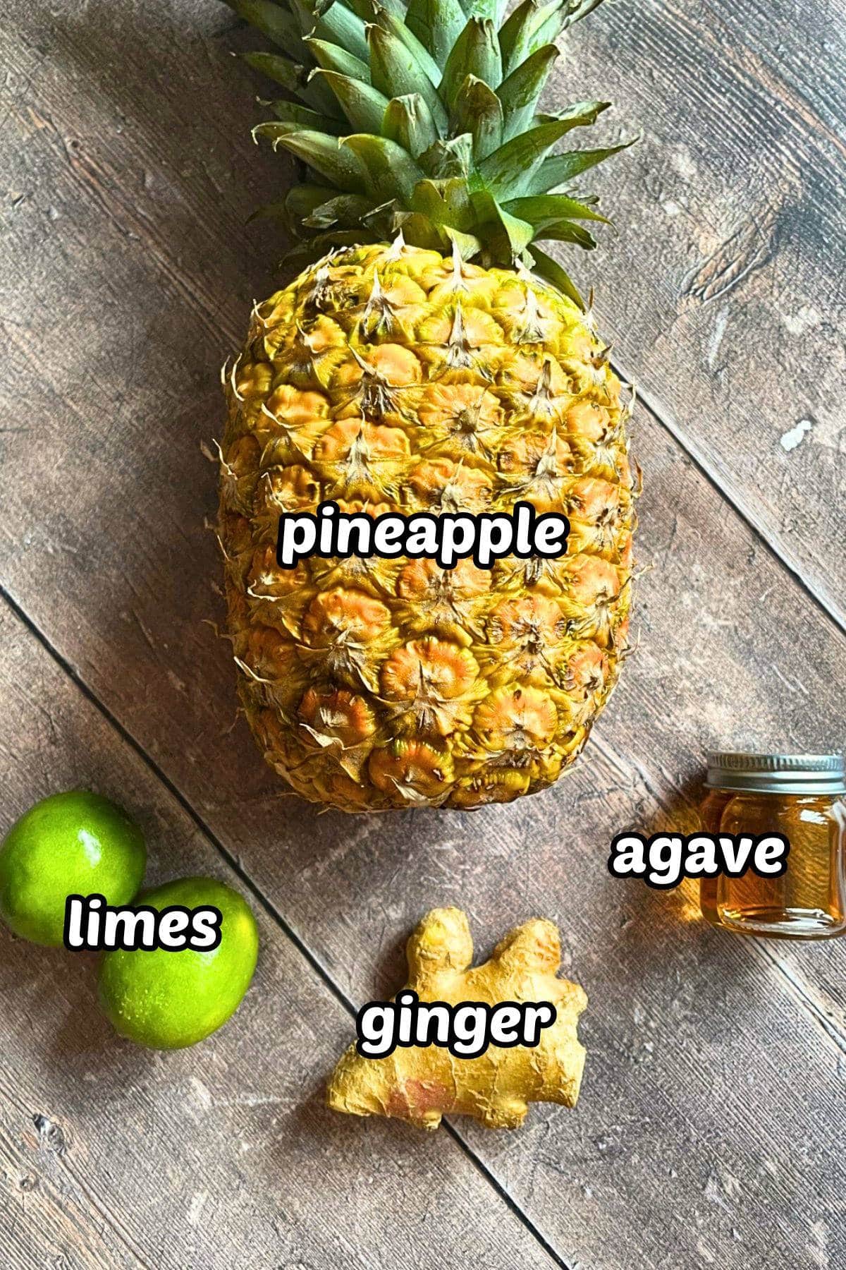 Grilled pineapple juice ingredients labeled on wooden background.