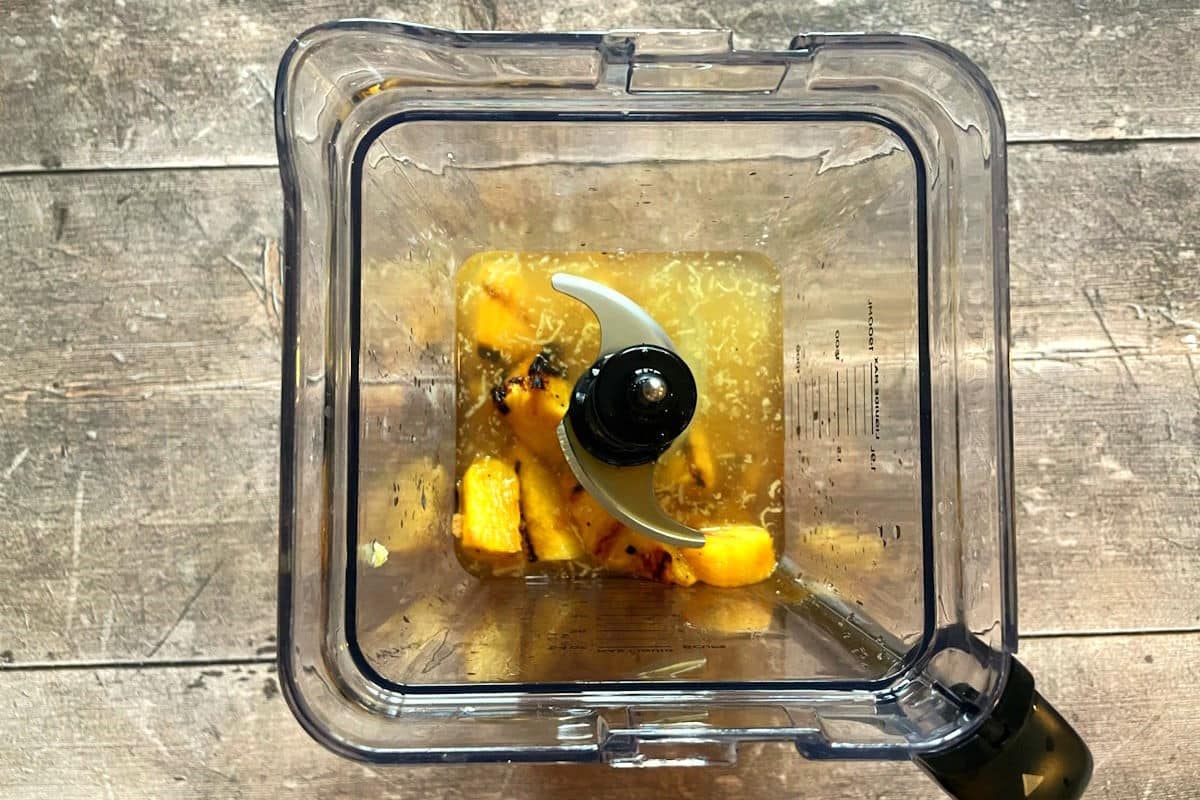 Grilled pineapple juice ingredients in blender.