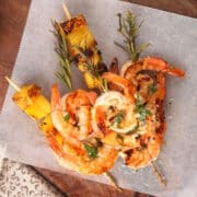 Grilled shrimp and pineapple on rosemary skewers.
