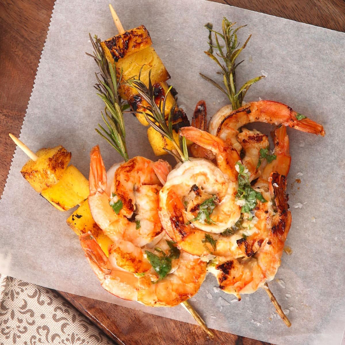 Grilled shrimp and pineapple on rosemary skewers.