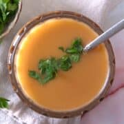 Ham gravy in dish with parsley.