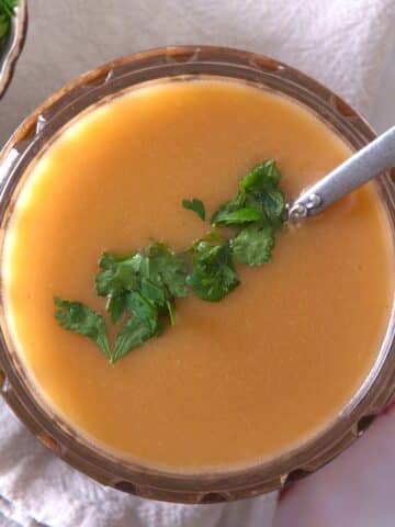 Ham gravy in dish with parsley.