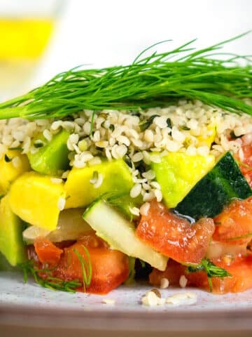 Hemp seed salad stacked on plate.