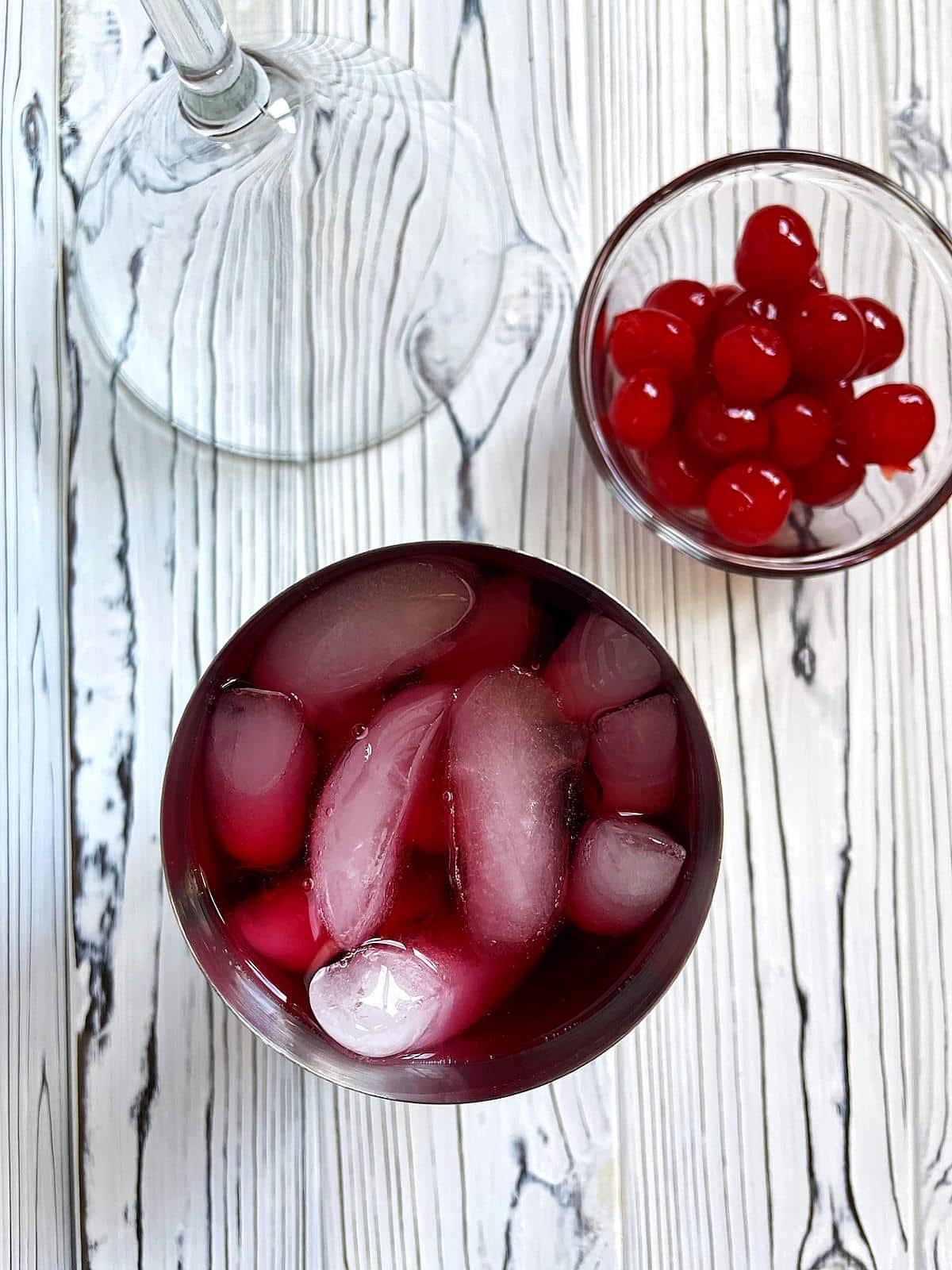 Hibiscus cosmo ingredients in cocktail shaker.
