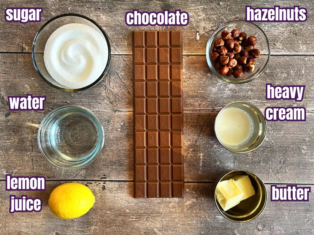 Chocolate caramel bar ingredients labeled on wooden background.