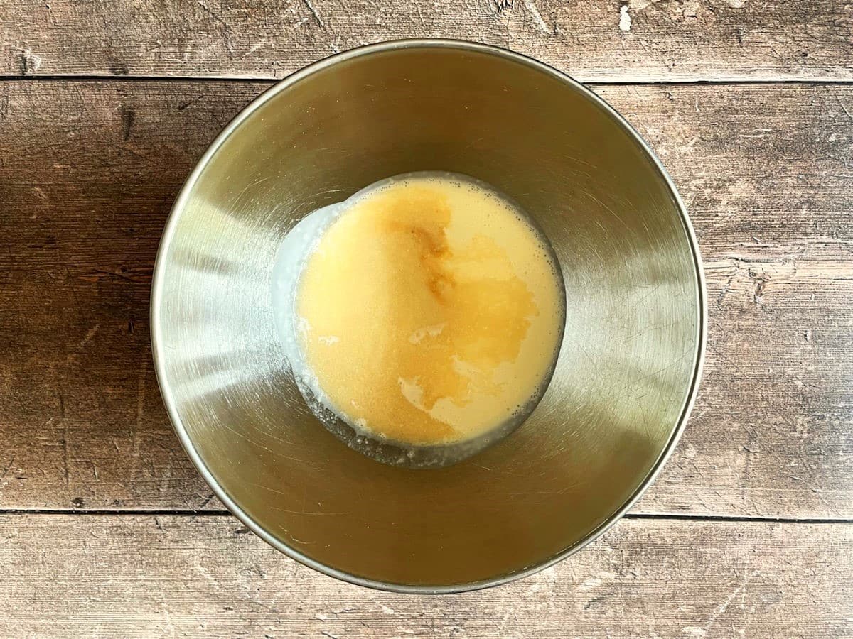 Sweet bourbon whipped topping ingredients in bowl.