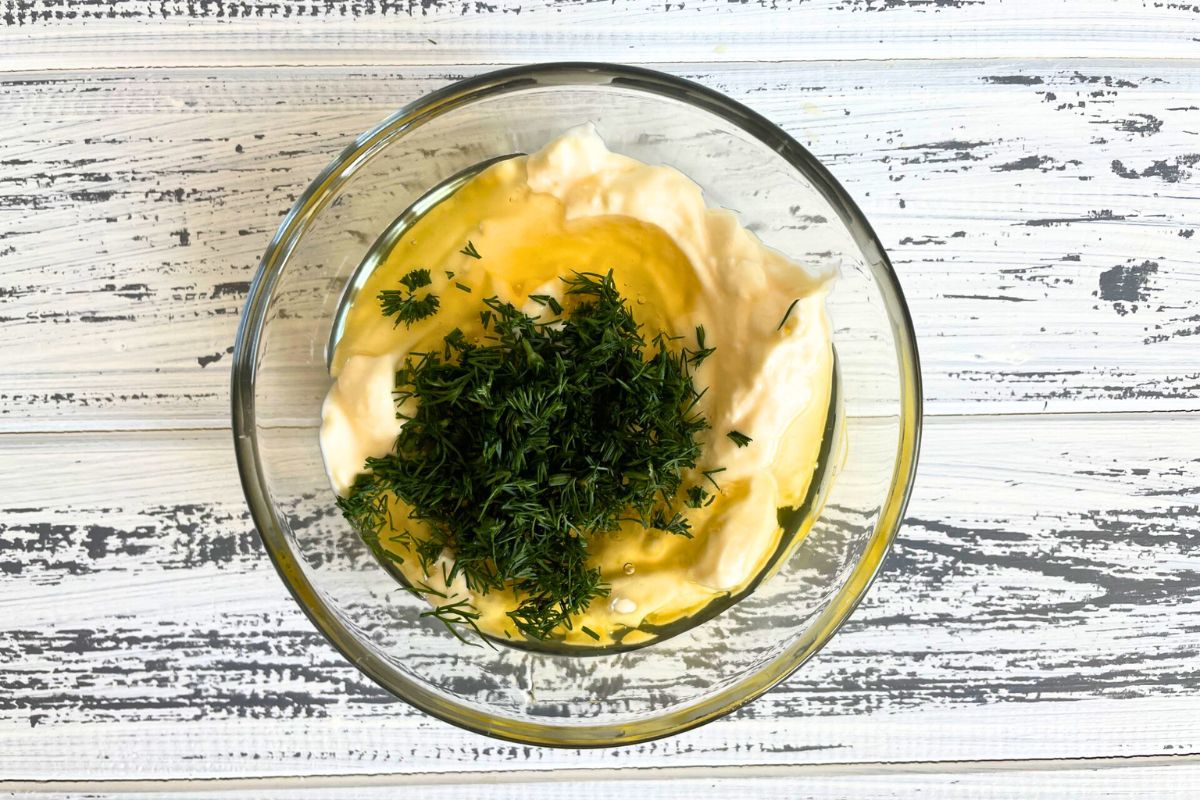 Honey dill sauce ingredients in small glass bowl.