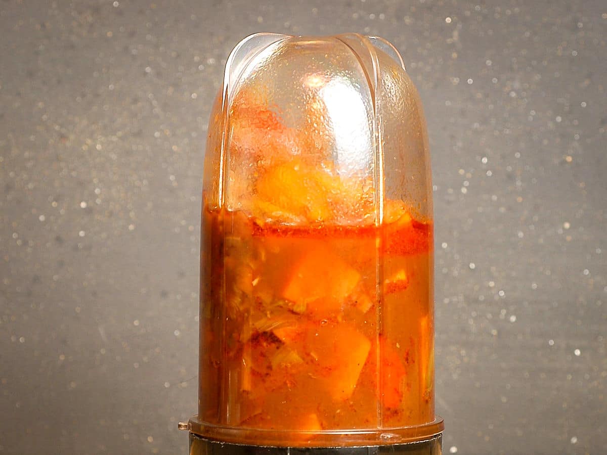 Pureed vegetables in blender jar.