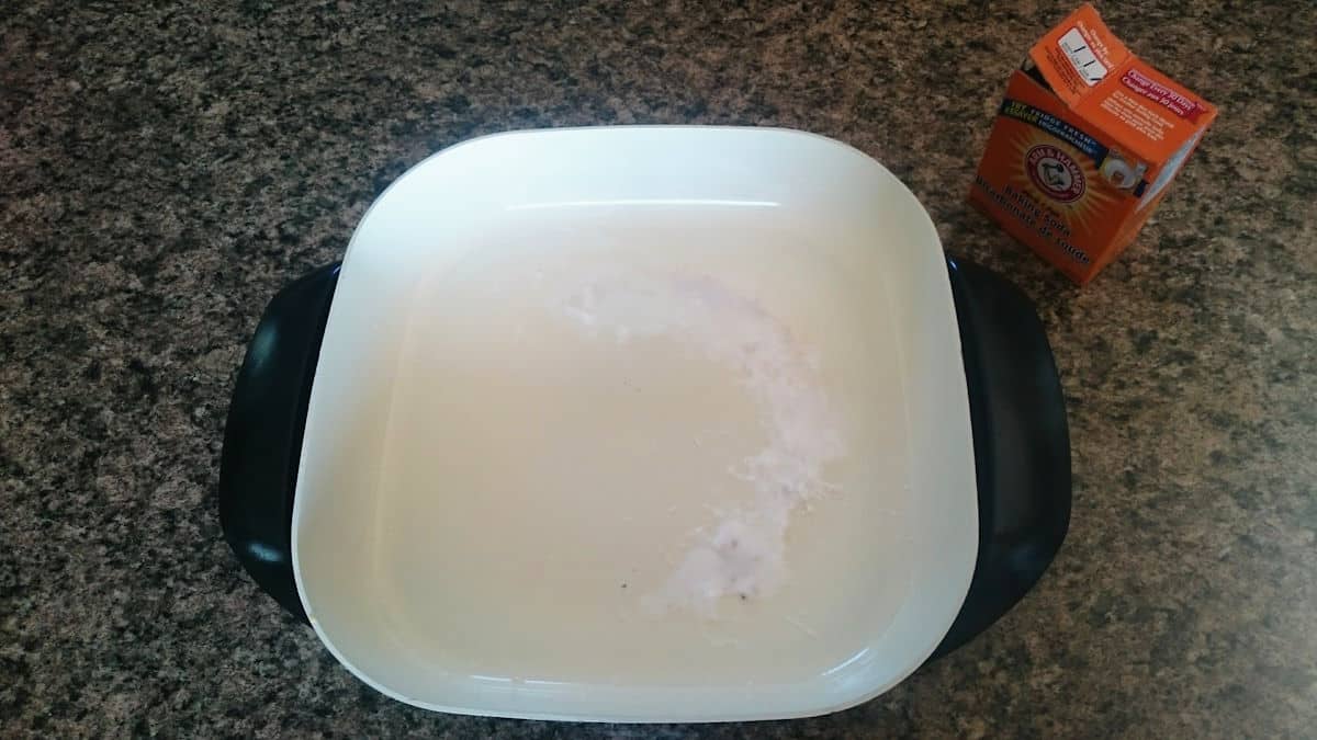 baking soda sprinkled on electric skillet Electric skillet with baking soda in it.
