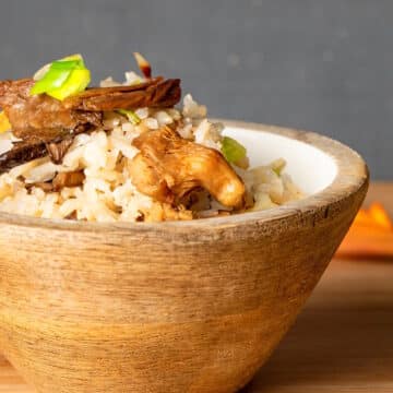 Brown rice in bowl with mushrooms.