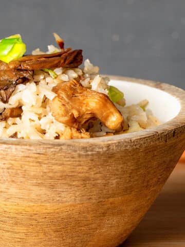 Brown rice in bowl with mushrooms.