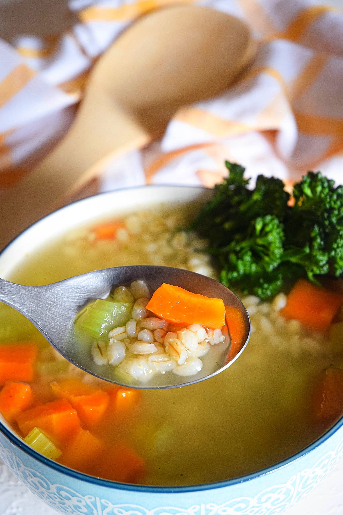 Barley soup in a bowl and spoon.