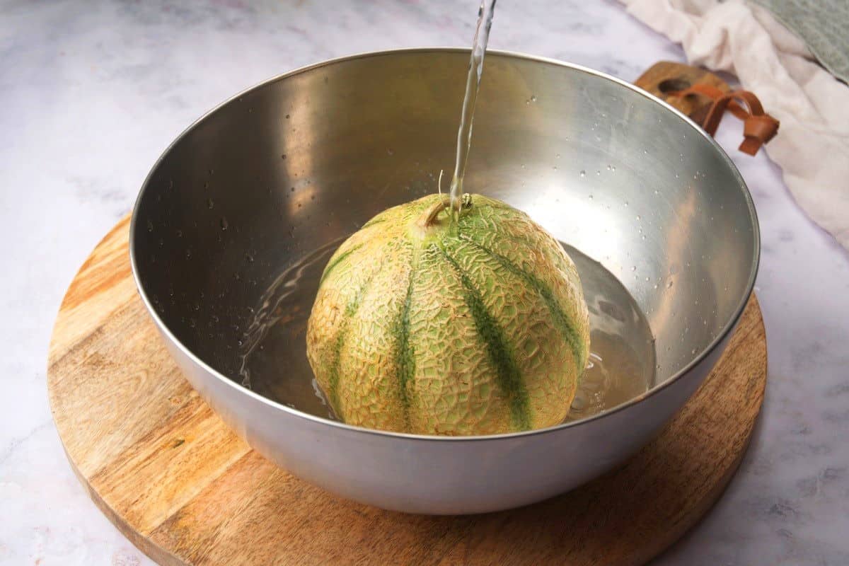 Cantaloupe getting cleaned.
