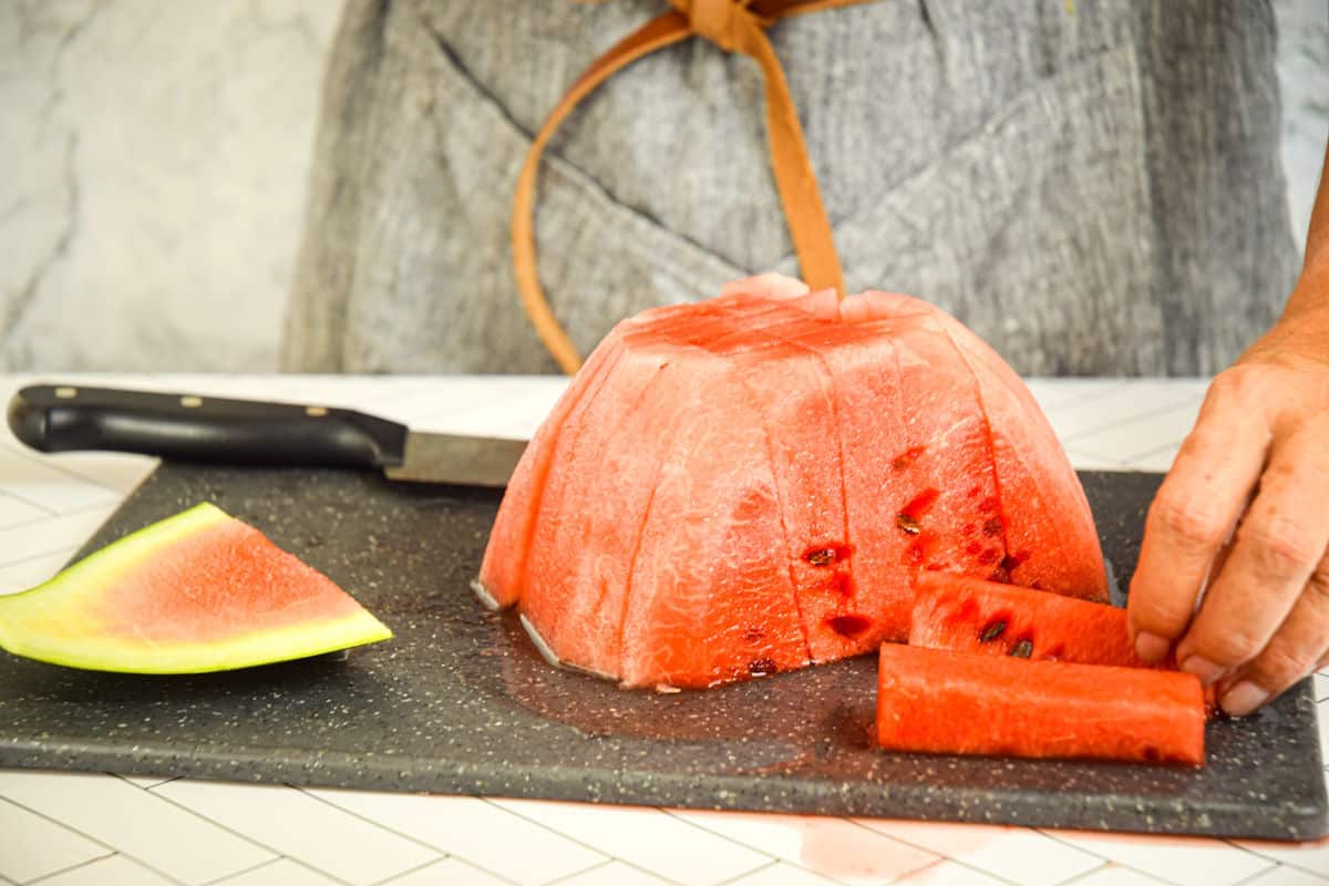 Watermelon sticks on cutting board.