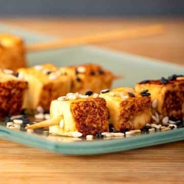 Fried tofu on serving plate.