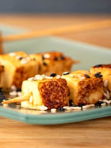 Fried tofu on serving plate.
