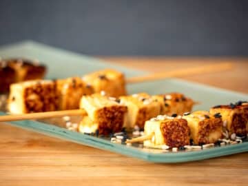 Fried tofu on serving plate.