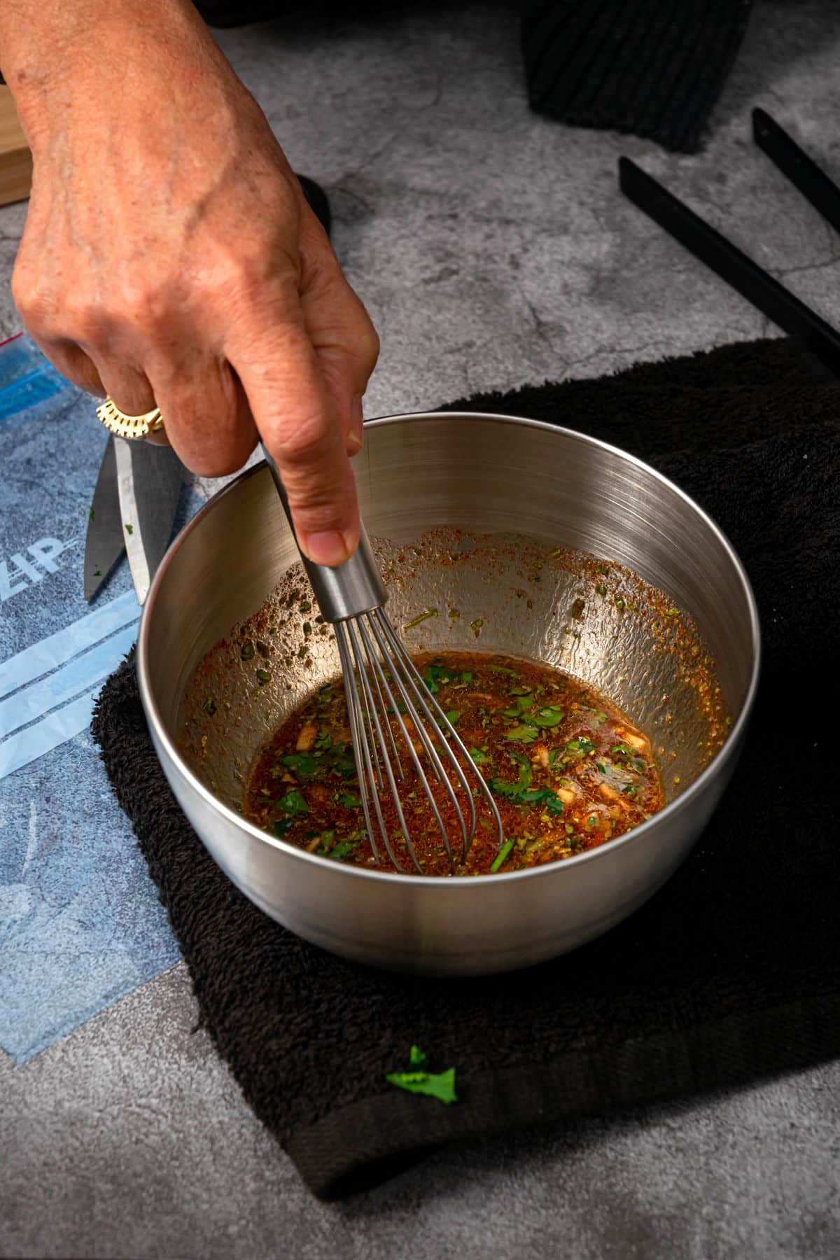 Steak marinade whisked in bowl.