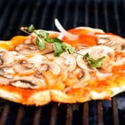 Pizza on a grill.