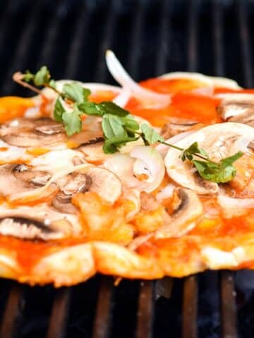 Pizza on a grill.