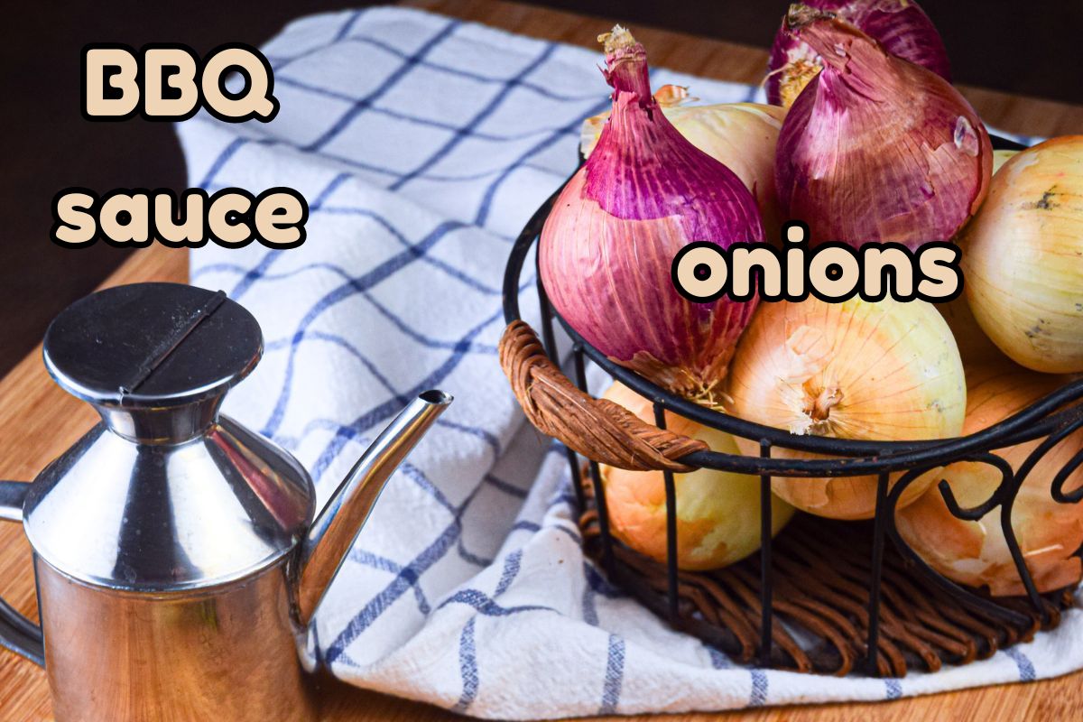 Red and yellow onions in wire basket.