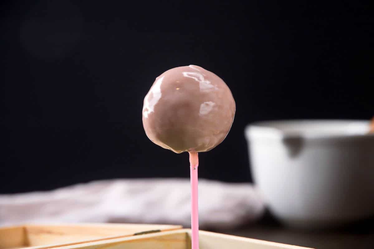 Cake pop with pink icing/glaze.