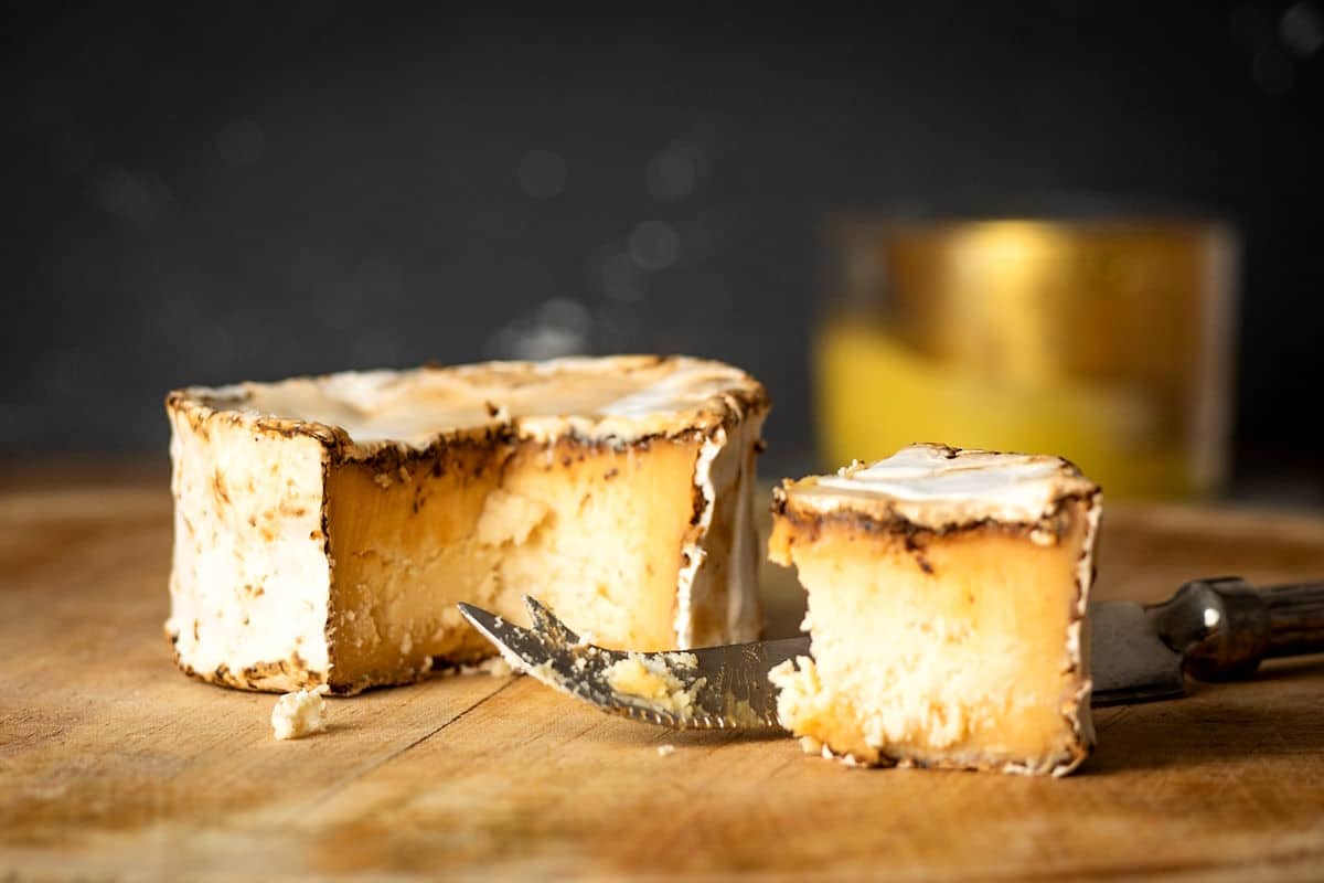 Goat cheese on wooden board.
