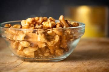 Walnuts on wooden board.