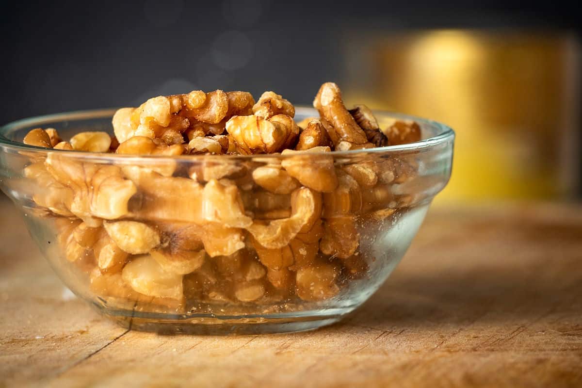 Walnuts on wooden board.
