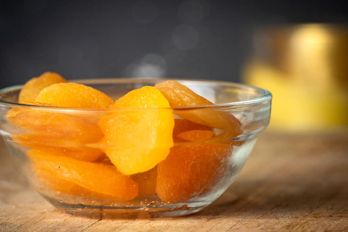 Apricots on wooden board.