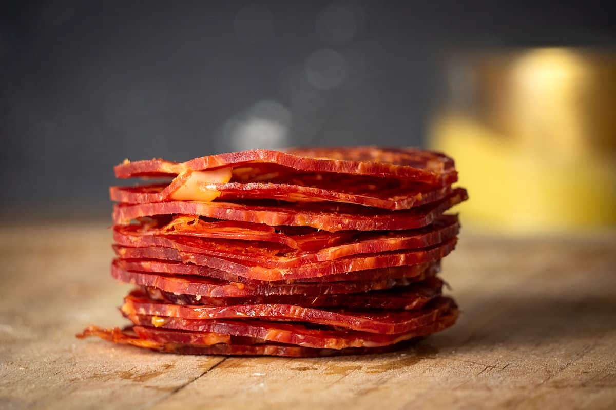Chorizo on wooden board.