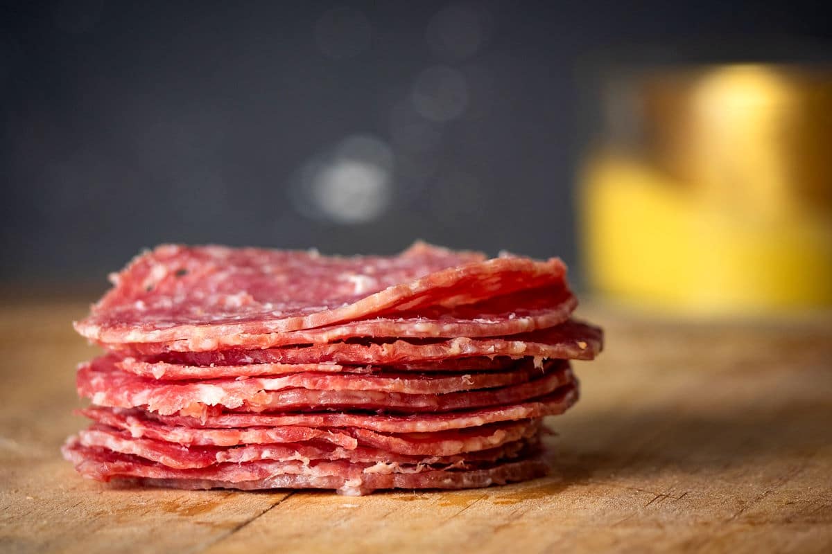 Salami on wooden board.