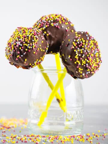 Decorated cake pops in jar.