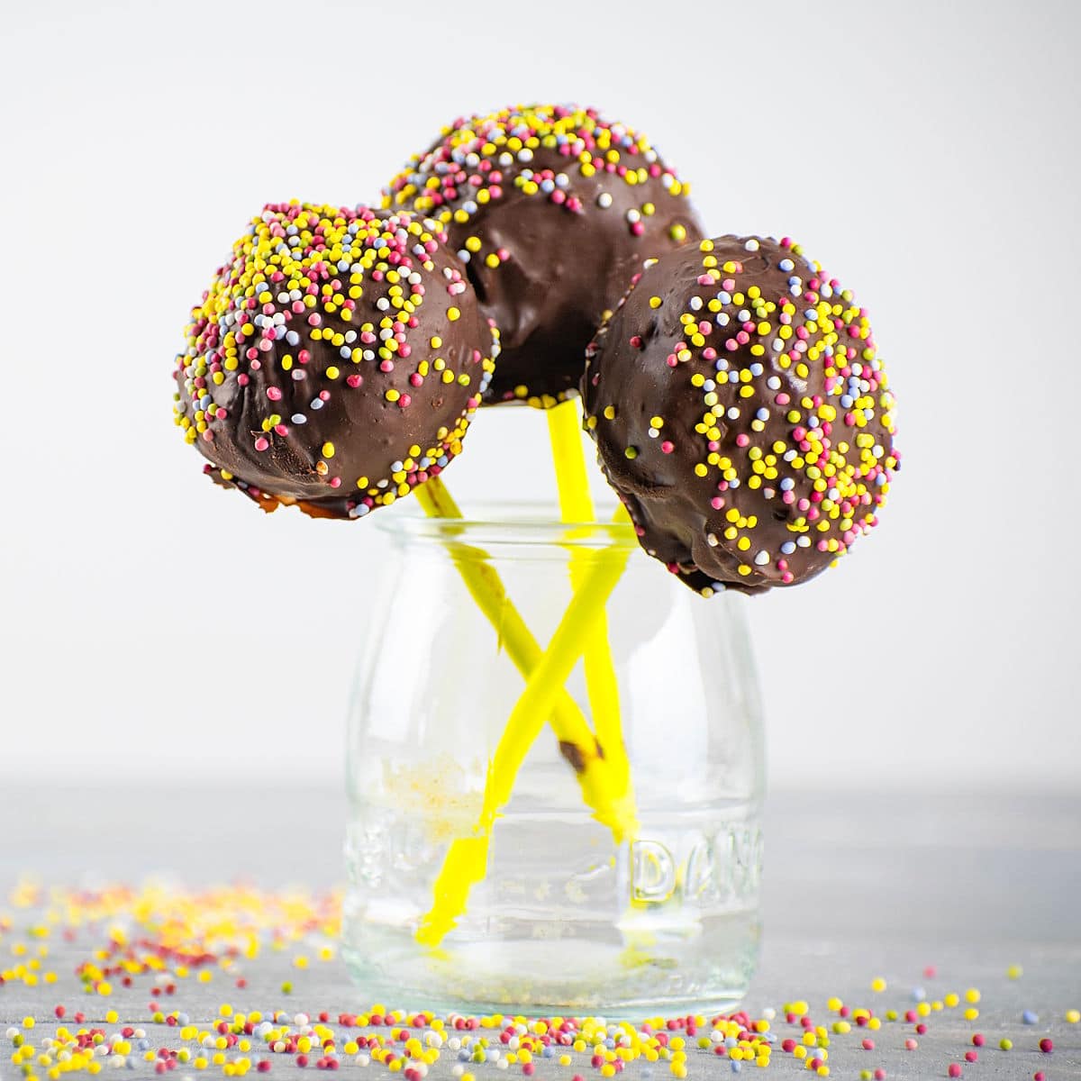 Decorated cake pops in jar.